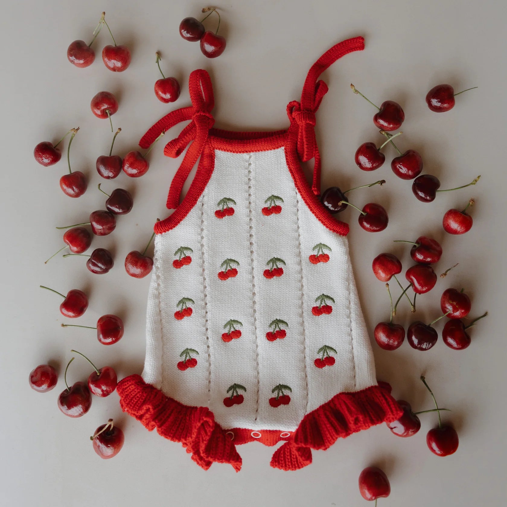 FOREVER FRENCH: Cherry Knit Ruffle Romper